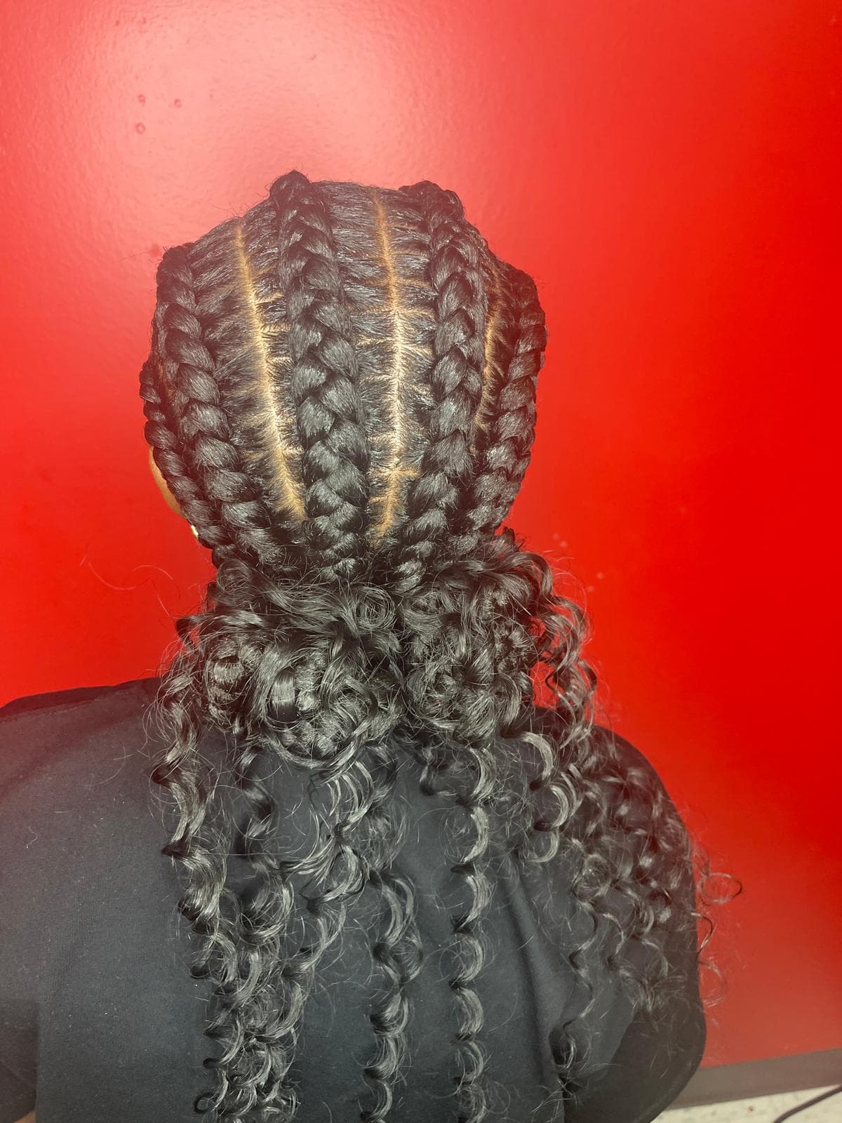 Fashionable woman with braided hair at Solange Hair Braiding
