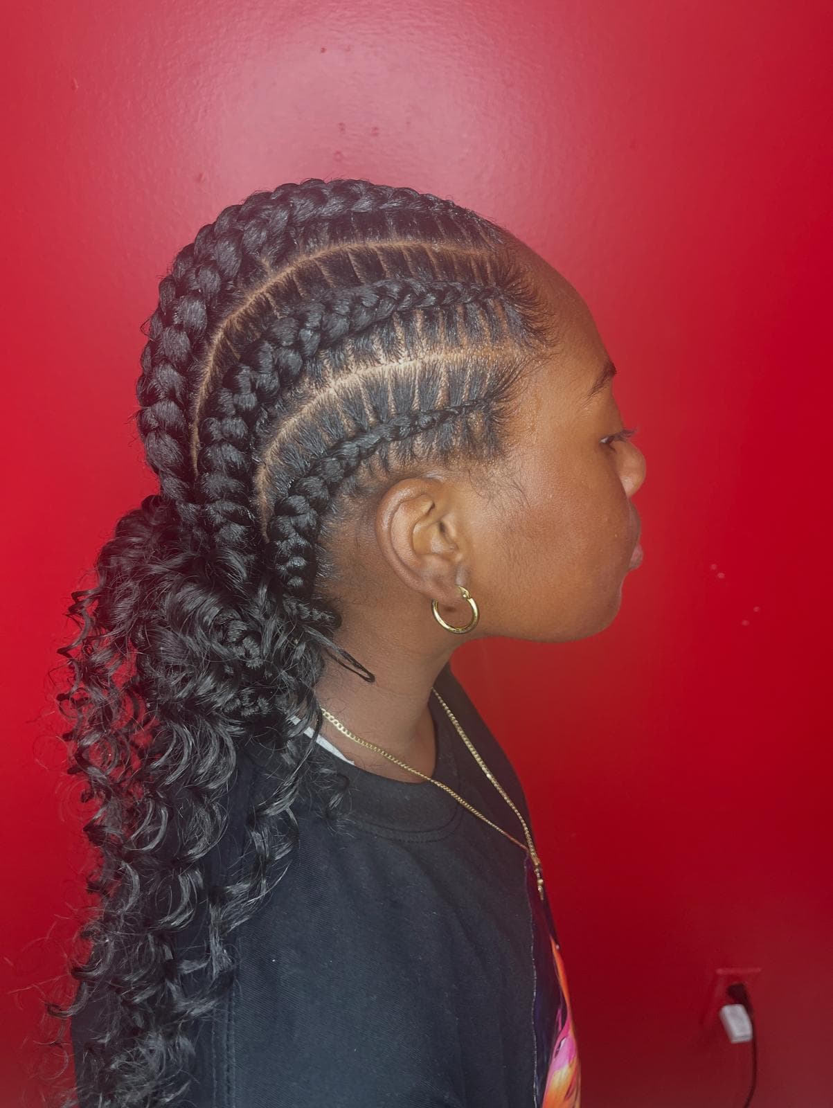 Young woman with braided hair at Solange Hair Braiding