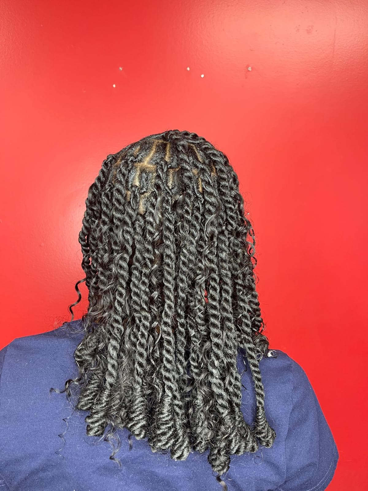 Beautiful knotless braids hairstyle at Solange Hair Braiding